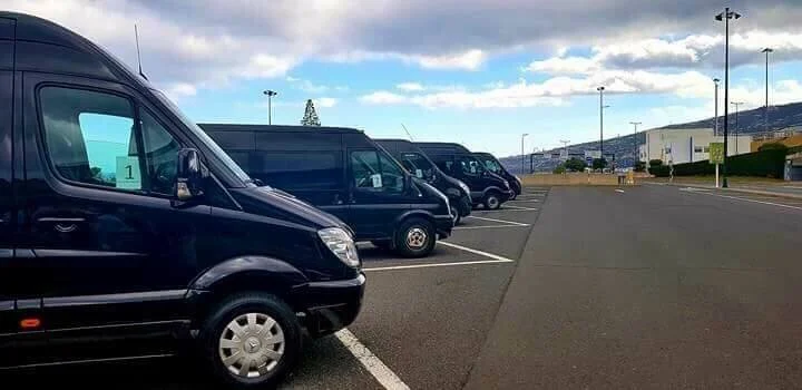 Madeira Airport to Funchal private transfers with VIP RC Transports, showing a fleet of vans ready for airport pick-up and hotel drop-off.